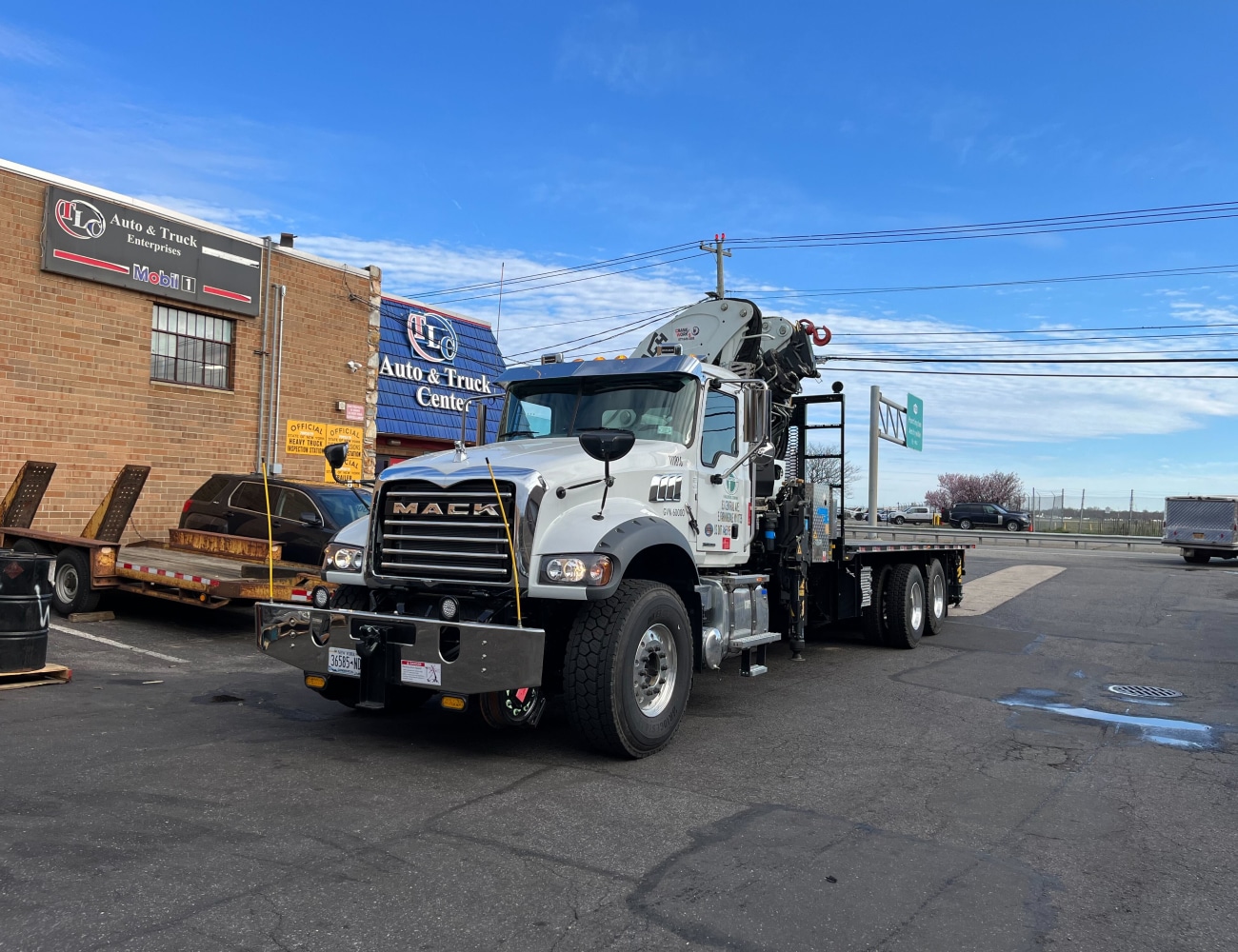 Mack flatbed truck at repair shop