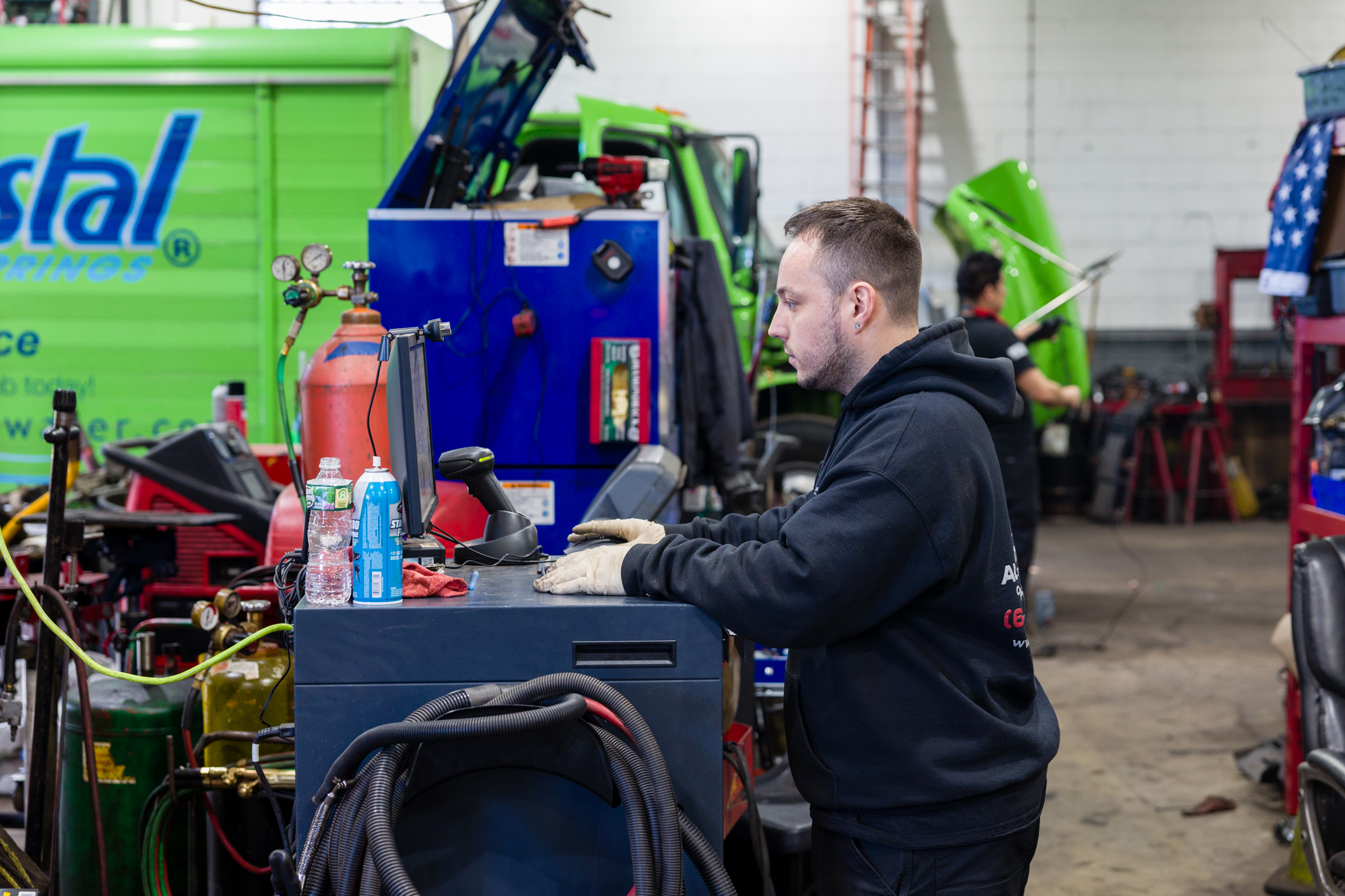 auto technician performing diagnostics